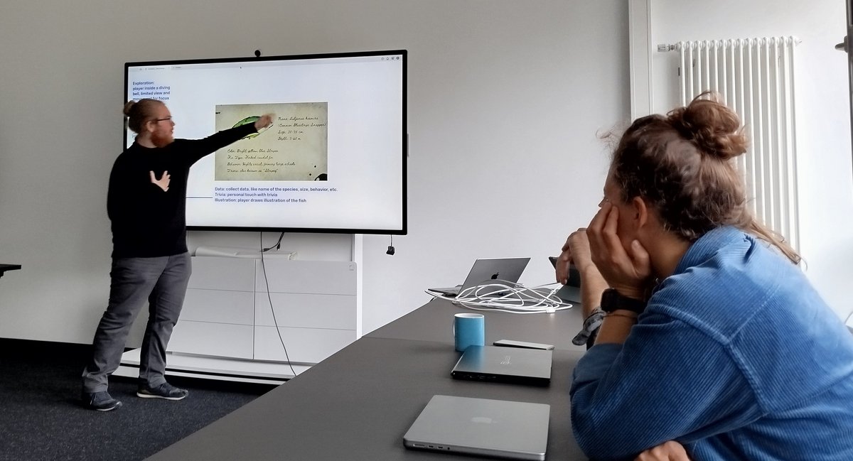 A person presents something on a screen