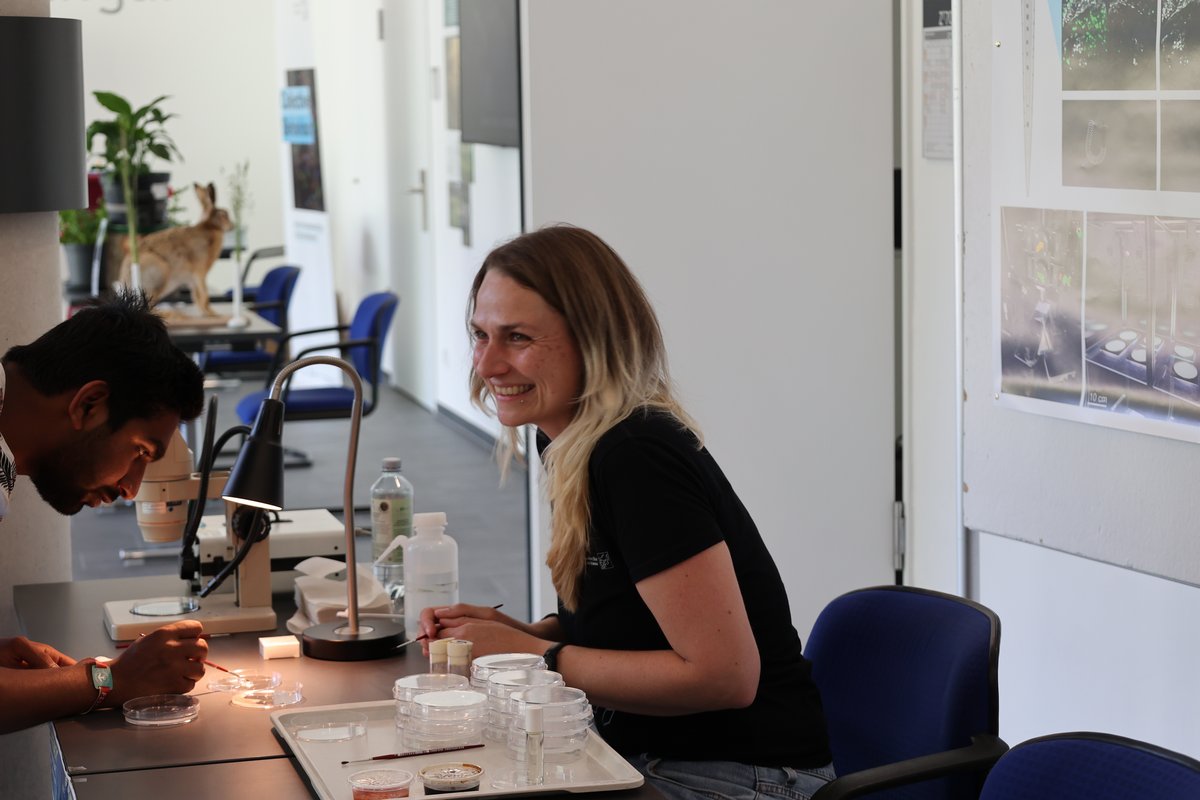 two people cindcuting one experiment on a table 