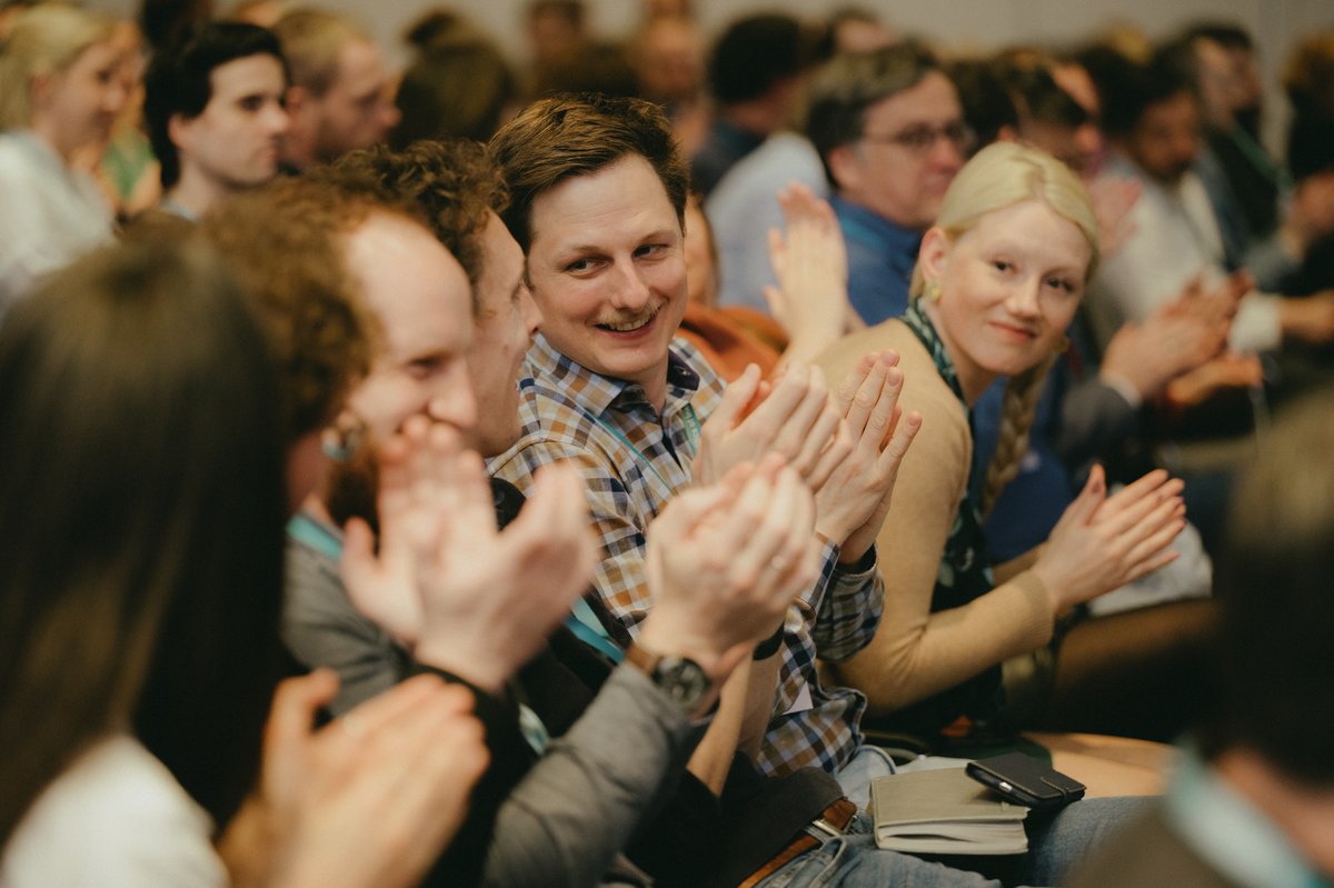 applauding PhD students in an audience